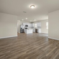 Photo by Curtis Adams: https://www.pexels.com/photo/empty-living-room-with-kitchenette-18041816/
